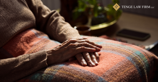 image of older lady sitting on a bed in a nursing home